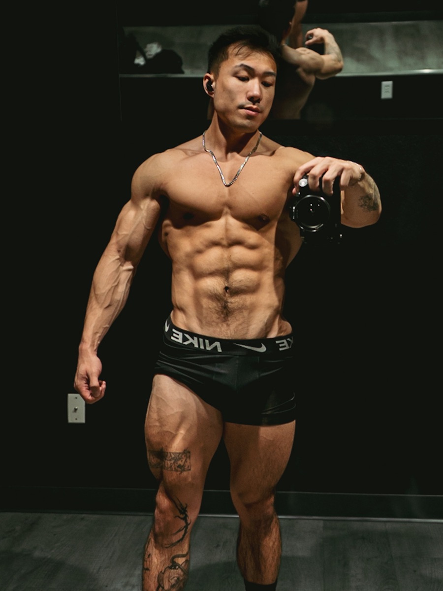 Zack today with a muscular, well-rounded physique in a dark gym